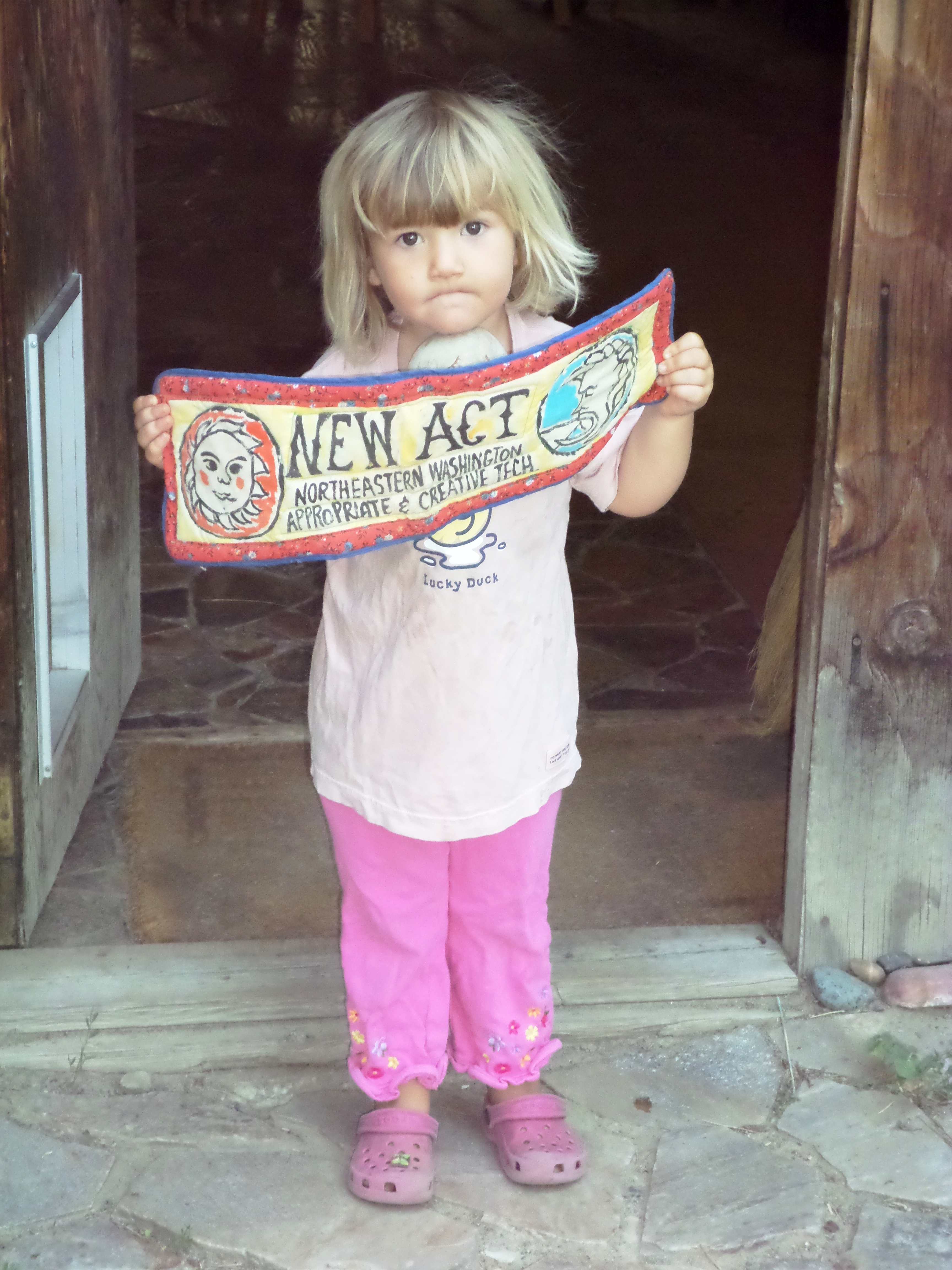 Nala with a NEW ACT sign